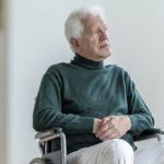 Man in a wheelchair with critical limb ischemia symptoms