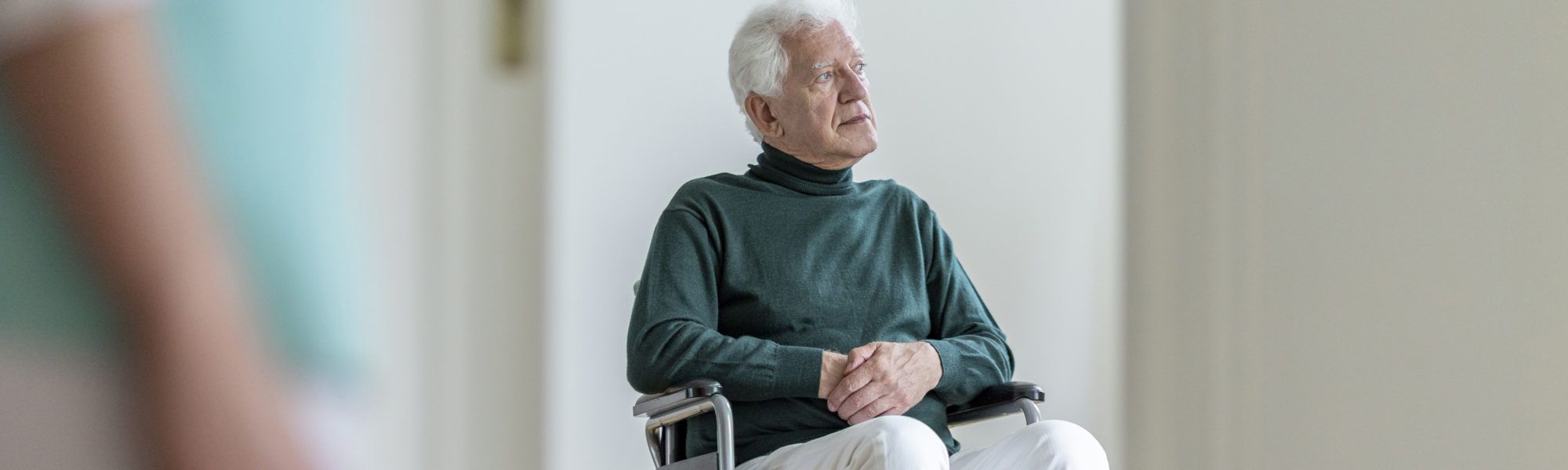 Man in a wheelchair with critical limb ischemia symptoms